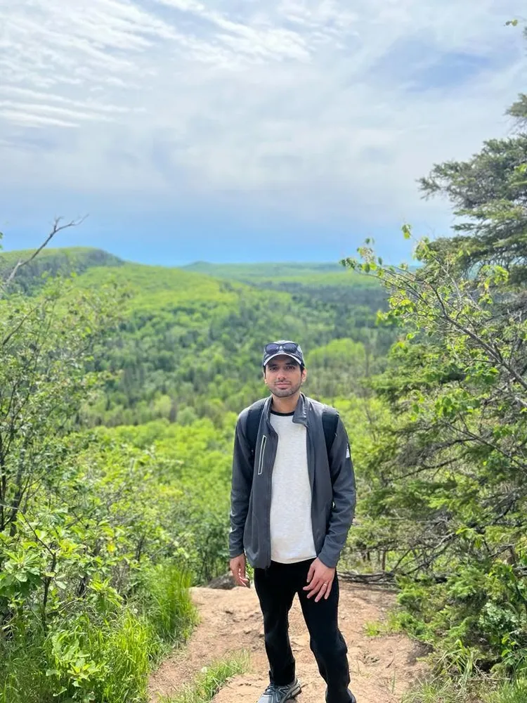 Standing on a mountain overlook after a hike