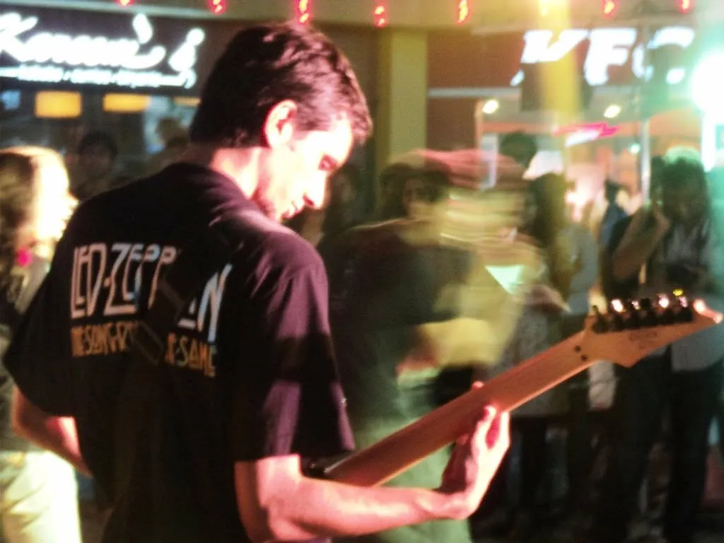 Playing guitar at a live show