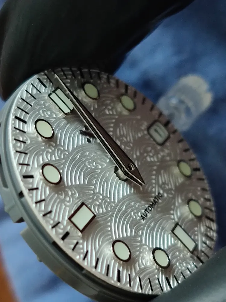Macro shot of a silver watch dial